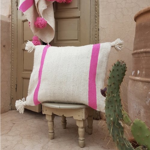 pompom blanket pillow with white pompoms